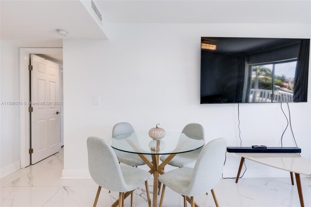 view of tiled dining space