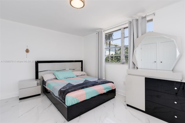 bedroom with light tile floors