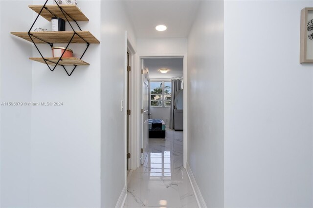 hallway with tile floors