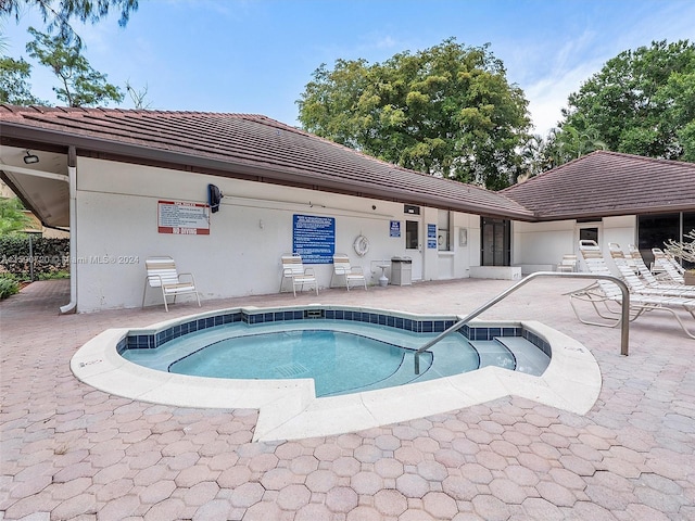 view of swimming pool featuring a patio