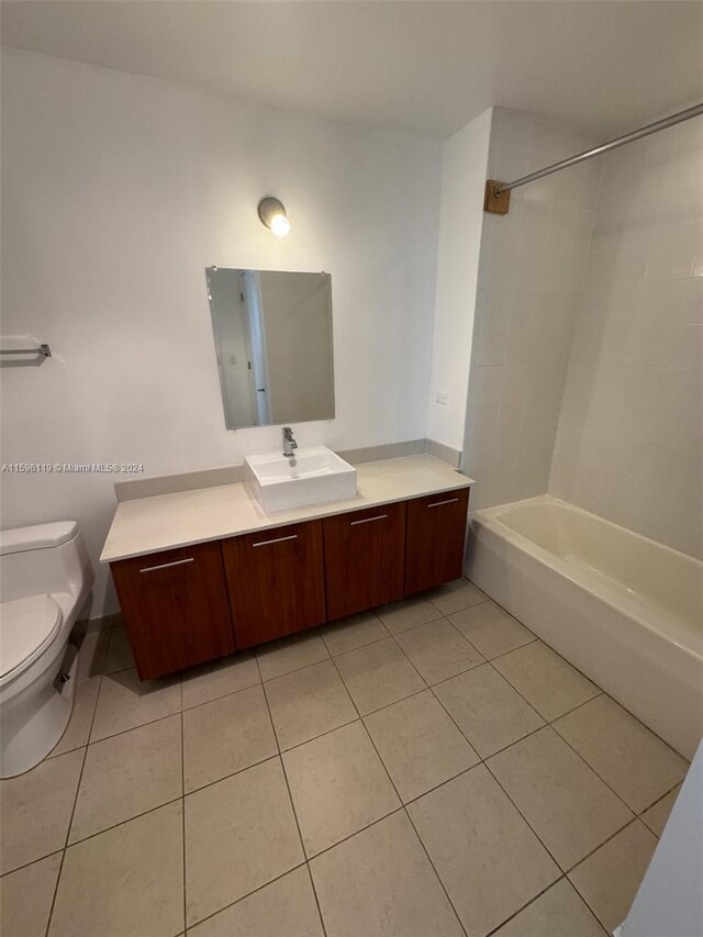 full bathroom featuring tile patterned flooring,  shower combination, toilet, and vanity