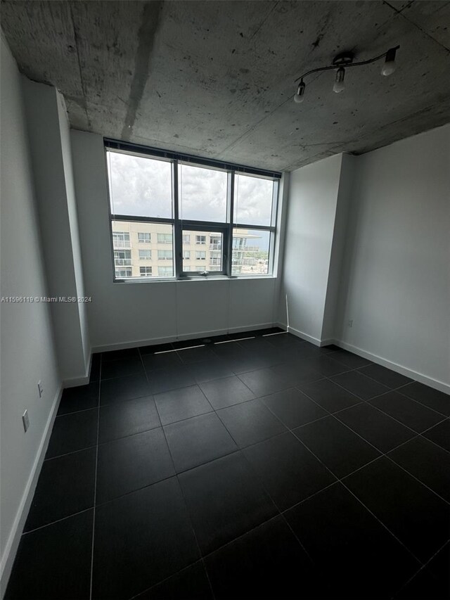 view of tiled spare room