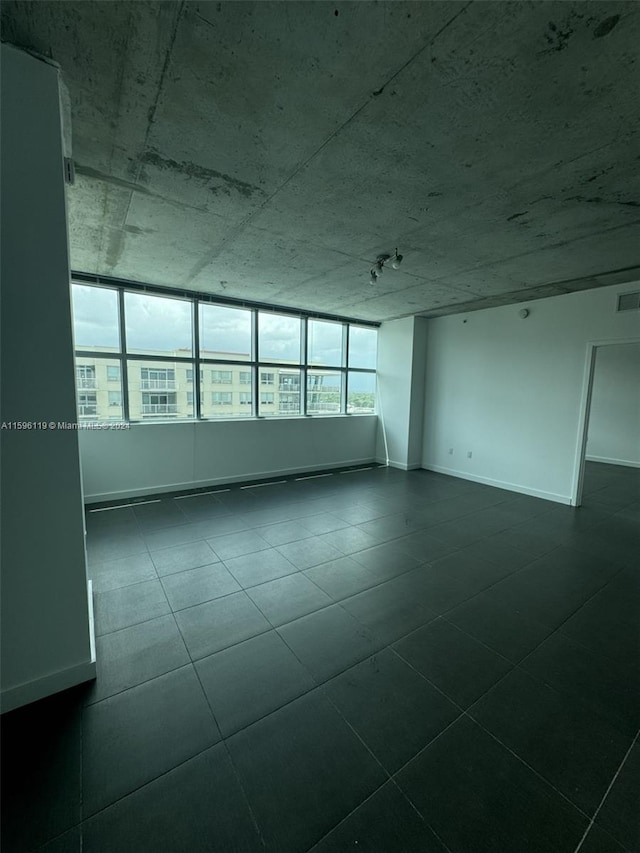 unfurnished room featuring tile patterned floors