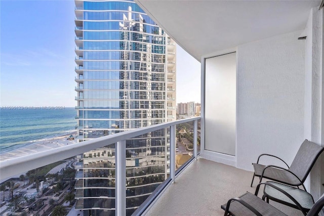 balcony featuring a water view