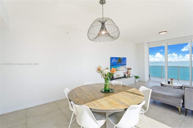 dining space featuring a wall of windows