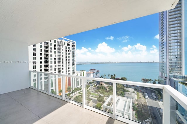 balcony featuring a water view