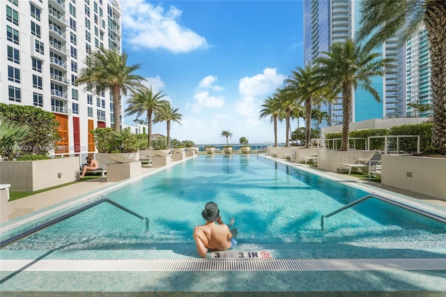 view of swimming pool featuring a patio