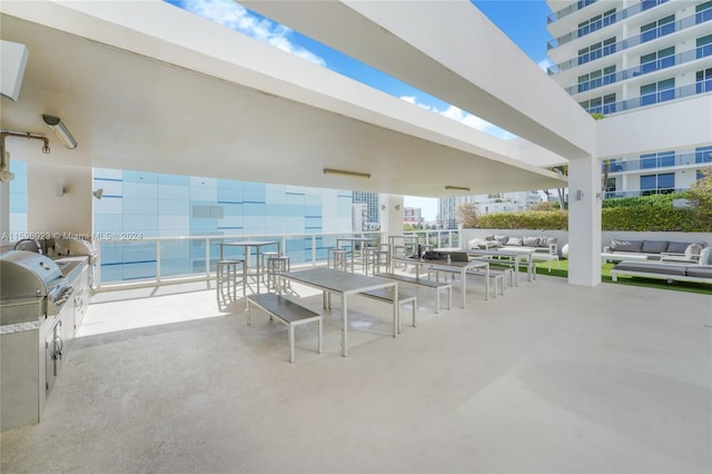 view of patio featuring a grill, area for grilling, and an outdoor hangout area