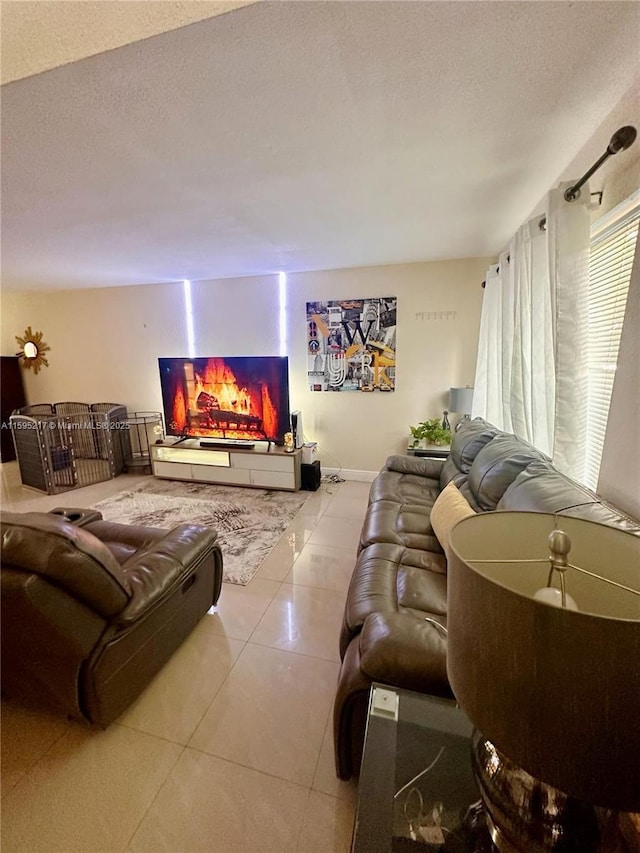 tiled living area with a textured ceiling