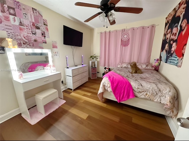 bedroom featuring ceiling fan and light hardwood / wood-style flooring