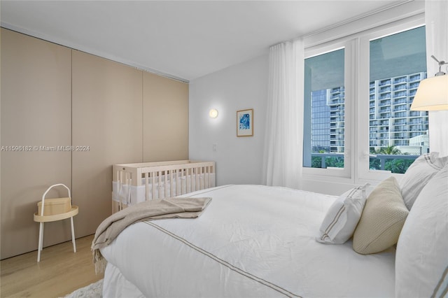 bedroom with wood finished floors