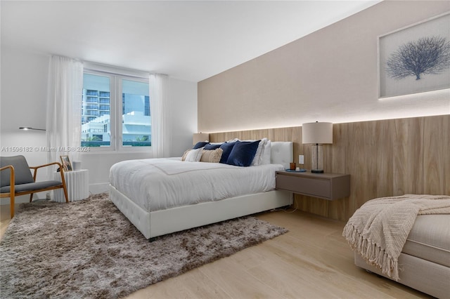 bedroom with wood finished floors