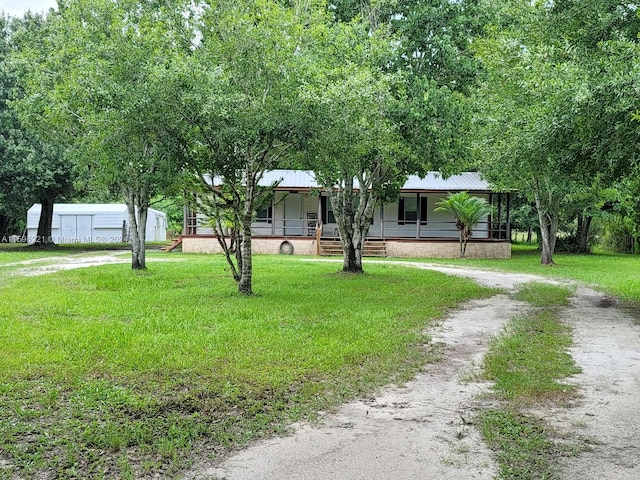 view of front facade with a porch and a front lawn