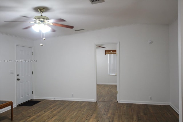 spare room with ornamental molding, dark hardwood / wood-style floors, and ceiling fan