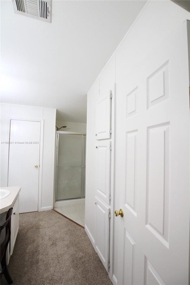 bathroom with vanity and an enclosed shower