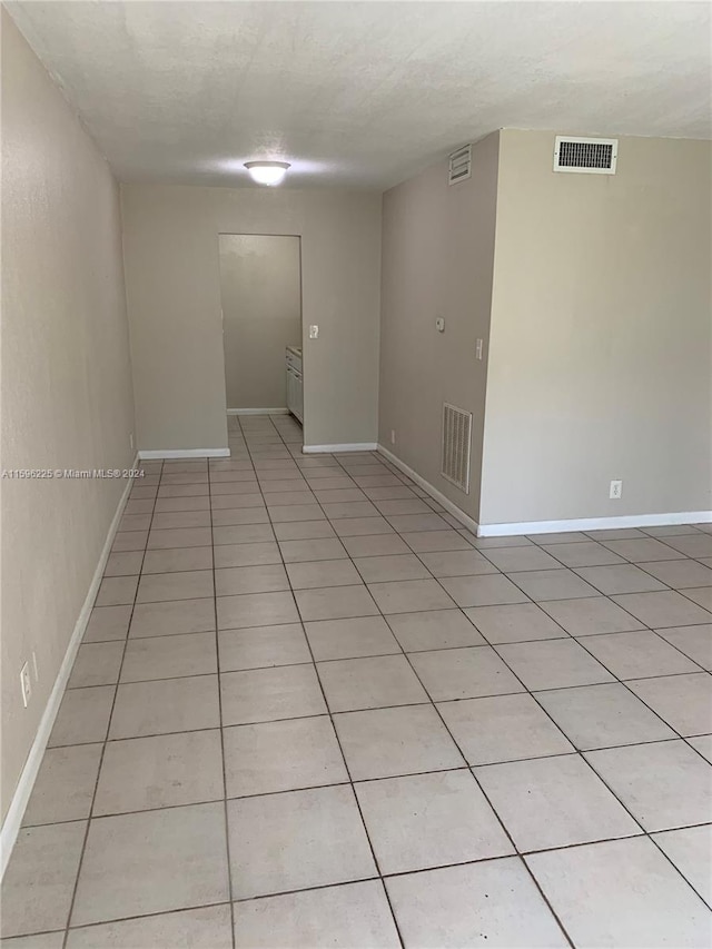 view of tiled spare room