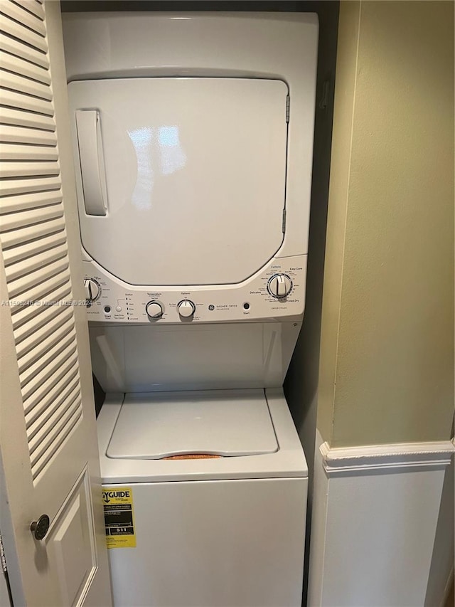 washroom with stacked washer / dryer