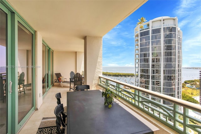 balcony featuring a water view