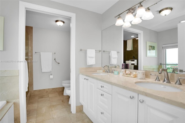 bathroom featuring tile patterned floors, vanity, toilet, and a bidet