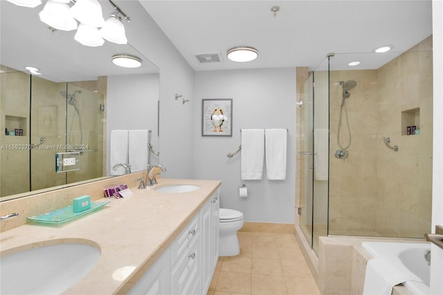 full bathroom featuring toilet, shower with separate bathtub, vanity, and tile patterned floors