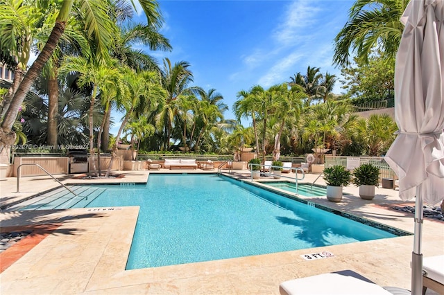 view of swimming pool featuring a patio area