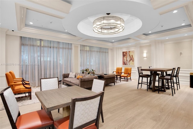 dining area featuring a chandelier, light wood-type flooring, crown molding, and coffered ceiling