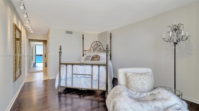 bedroom featuring dark hardwood / wood-style flooring