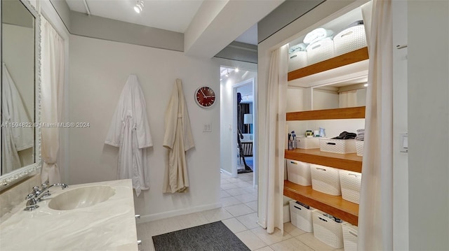 bathroom with tile patterned flooring and vanity