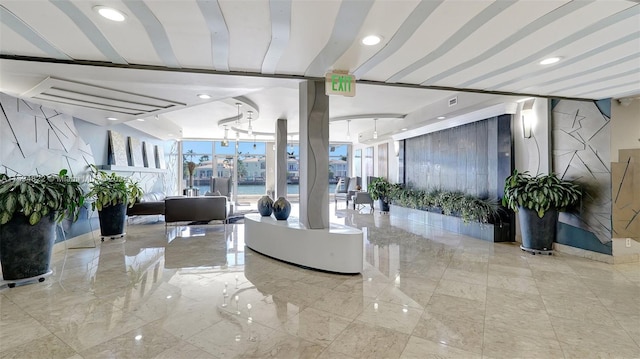 building lobby featuring a water view