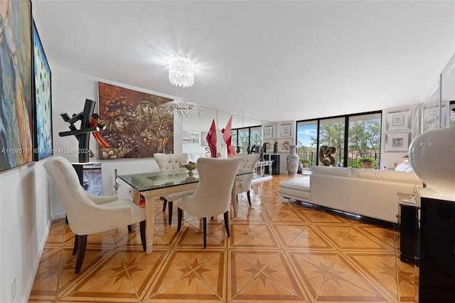 dining room with expansive windows and a chandelier