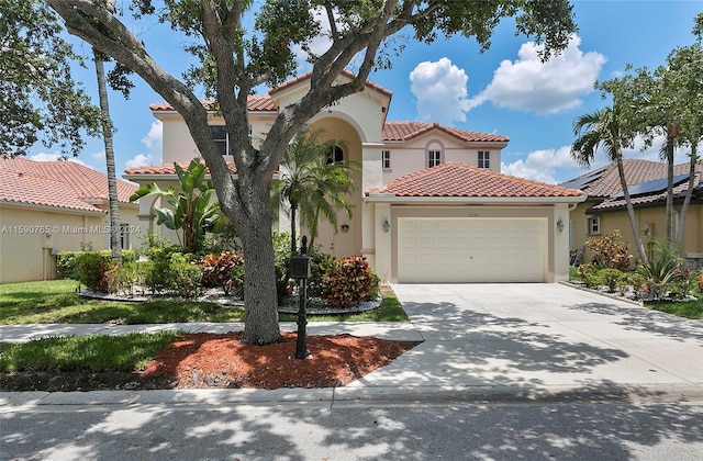 mediterranean / spanish-style home featuring a garage