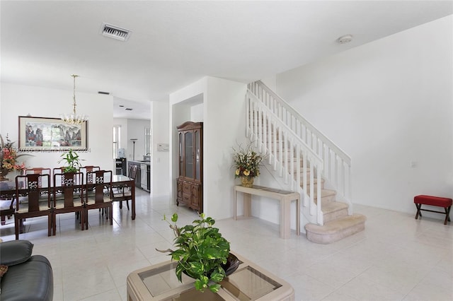 interior space with light tile patterned floors and a chandelier