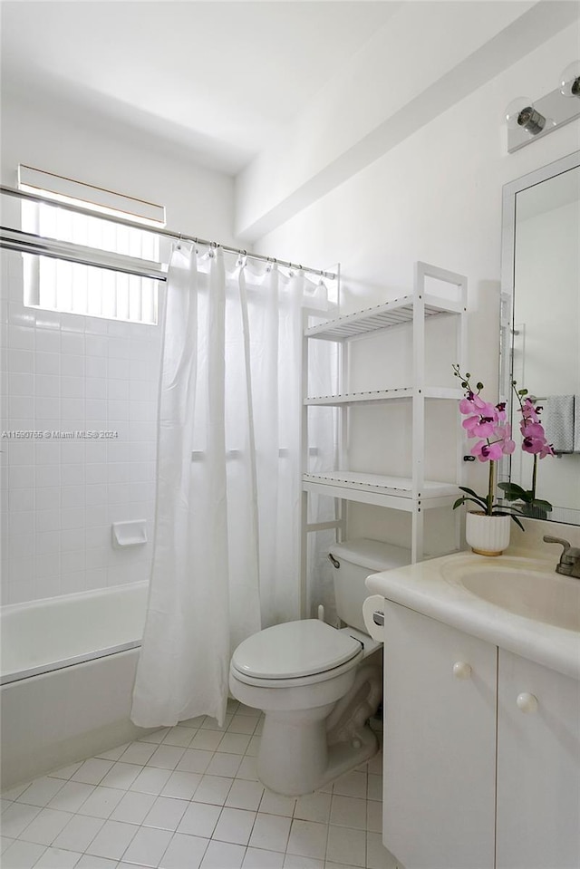 full bathroom with vanity, toilet, tile patterned floors, and shower / bath combo with shower curtain