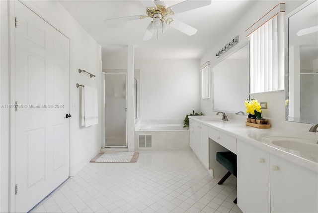 bathroom featuring tile patterned flooring, vanity, and separate shower and tub