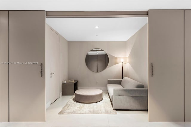 sitting room featuring light tile flooring