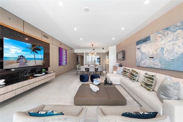 living room featuring an inviting chandelier and light tile floors