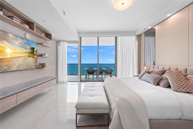 tiled bedroom featuring access to exterior, floor to ceiling windows, and a water view