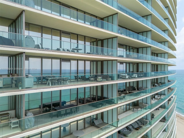 view of building exterior with a water view