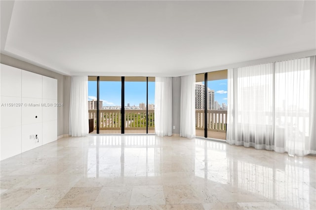 empty room featuring floor to ceiling windows