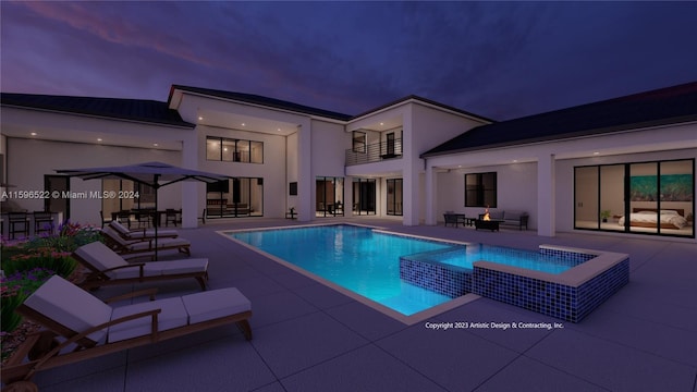 view of swimming pool with a patio and an in ground hot tub