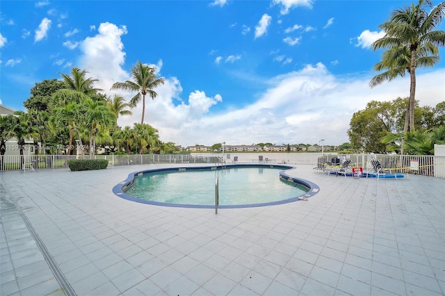 view of swimming pool featuring a patio area