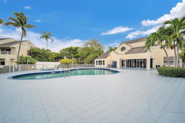 view of swimming pool with a patio