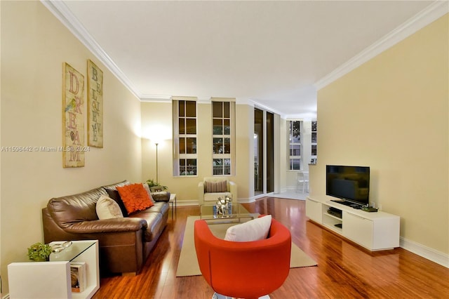 living room featuring ornamental molding and wood-type flooring