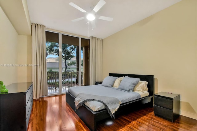 bedroom with dark hardwood / wood-style floors, ceiling fan, and access to exterior