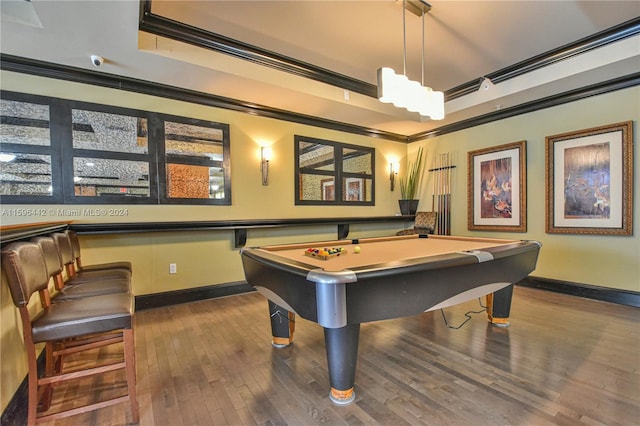 playroom with crown molding, billiards, a raised ceiling, and hardwood / wood-style floors