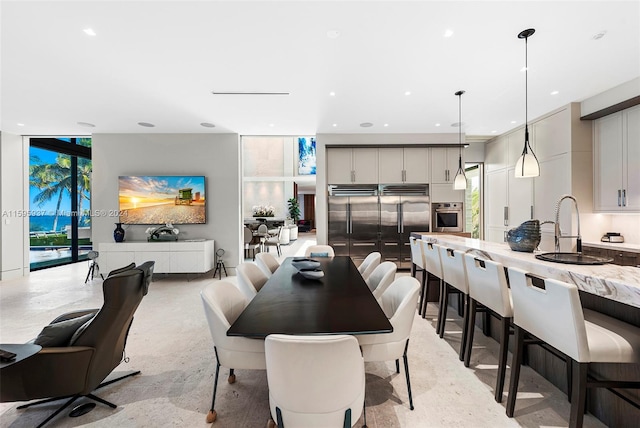 dining room featuring sink and expansive windows