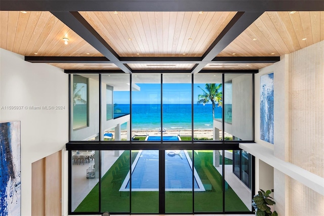 room details featuring wooden ceiling, a water view, and beam ceiling