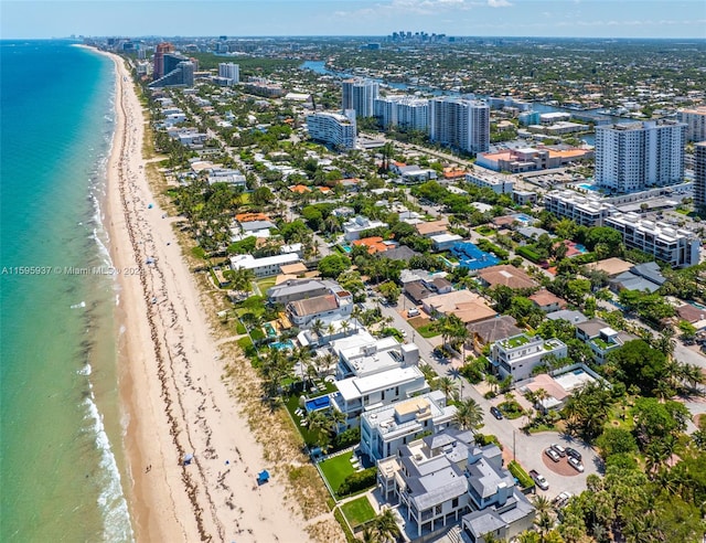 bird's eye view with a beach view and a water view