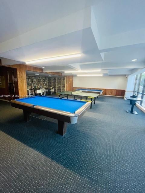 recreation room featuring pool table, carpet floors, and wooden walls