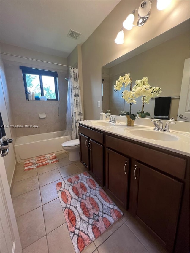 full bathroom featuring tile patterned floors, vanity, shower / bath combo, and toilet